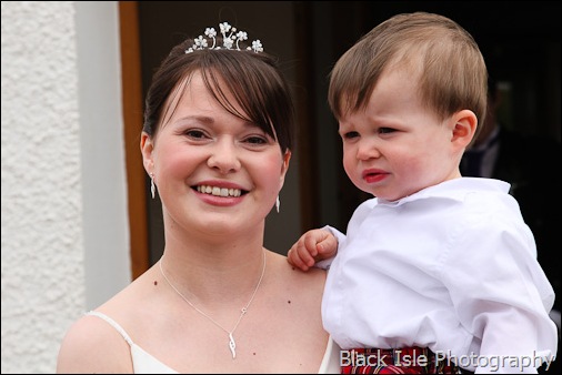 Wedding photograph of the bride with her son at Loch Carron in the Highlands